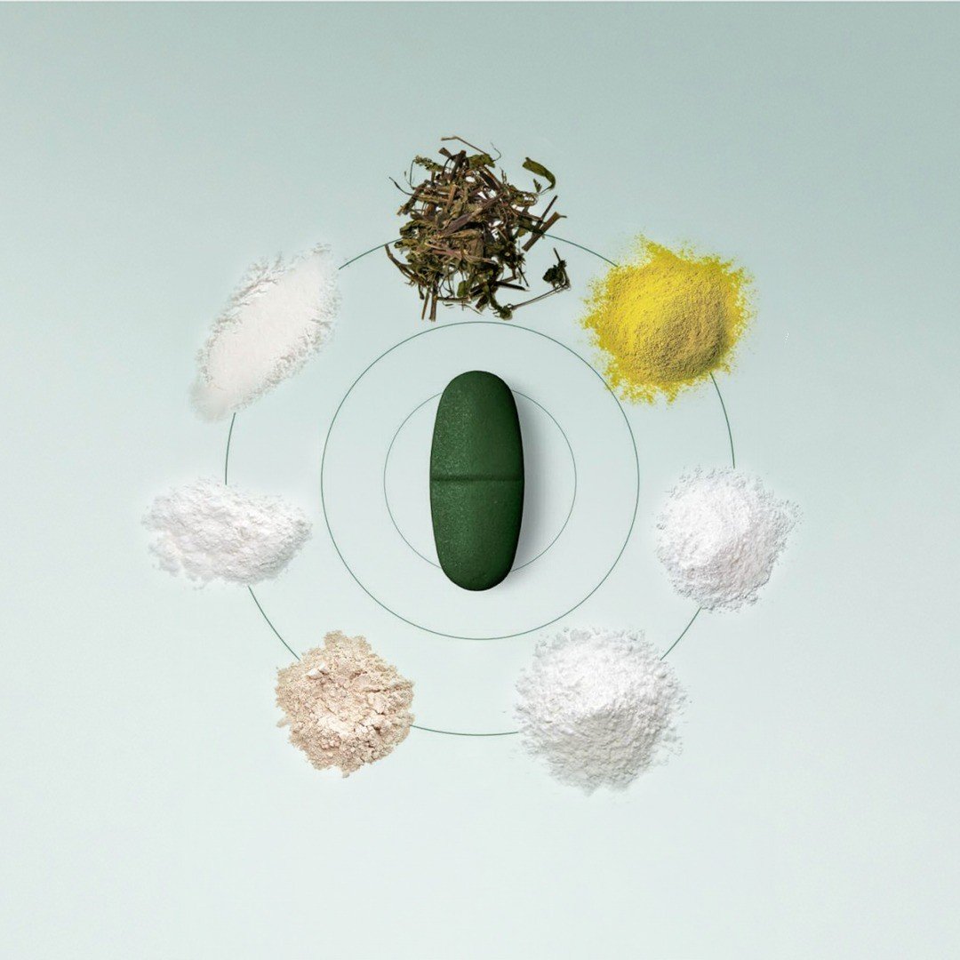 A group of pills, powders, and spices arranged in a circle.